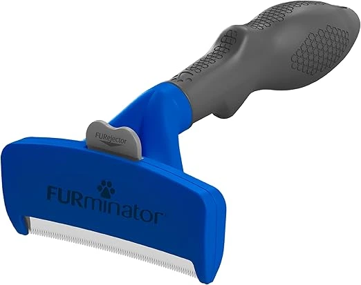 Dog with a relaxed dog smile during grooming with the Furminator Undercoat Deshedding Tool.