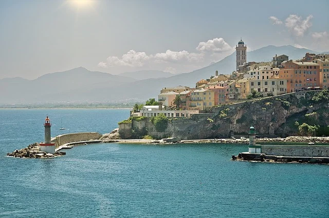 Dramatic coastal cliffs along the shore of Corsica, one of the most beautiful islands in the Mediterranean, with turquoise sea below.