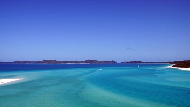 Breathtaking view of Whitehaven Beach on the Whitsunday Islands, recognized as one of the most beautiful islands, with pristine white silica sand